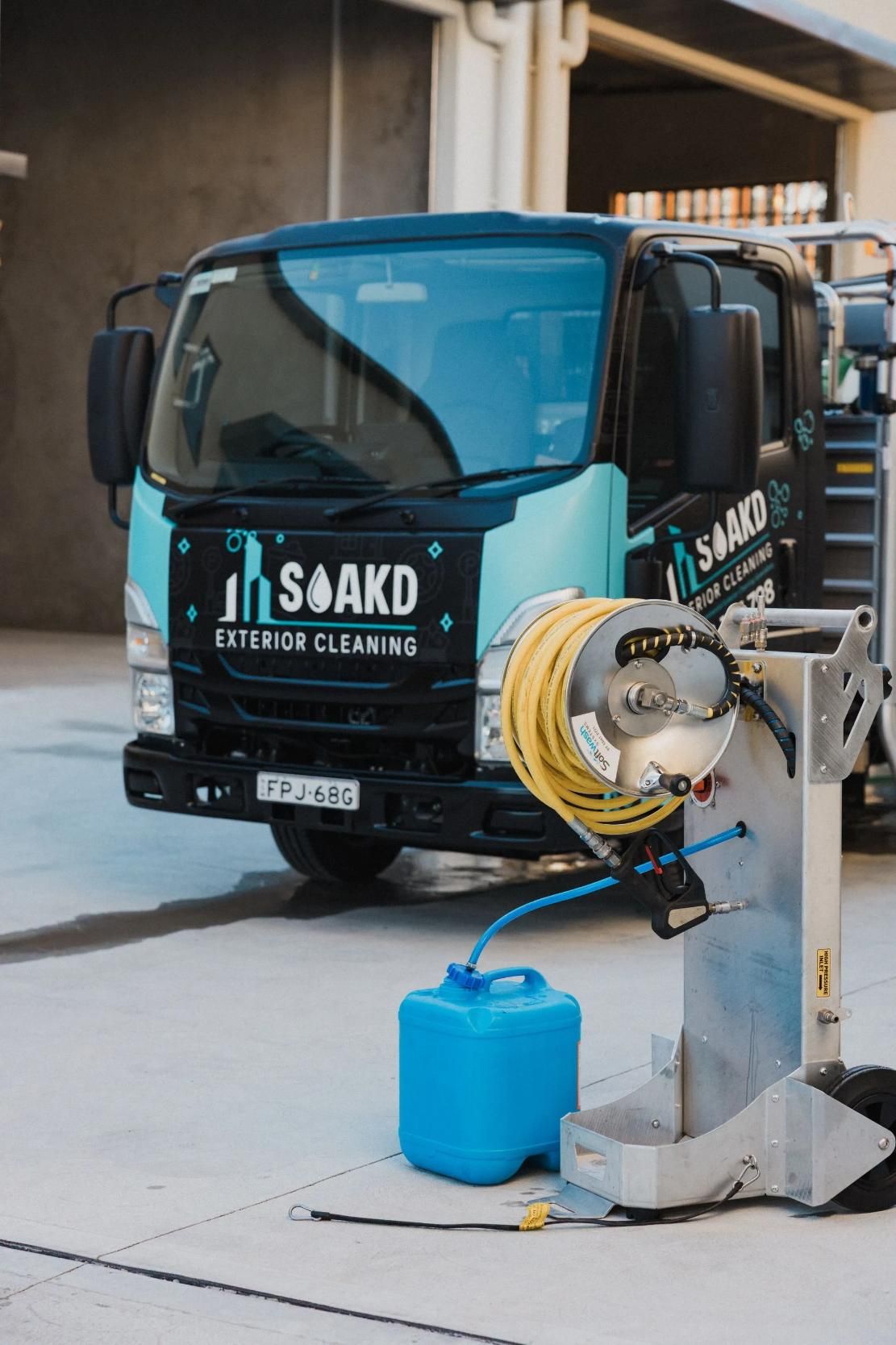 SOAKD Exterior Cleaning branded service vehicle and team equipment